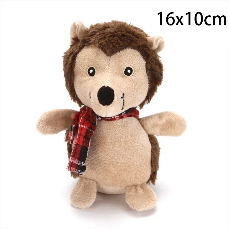 A small plush hedgehog toy with brown and beige fur, wearing a red plaid scarf